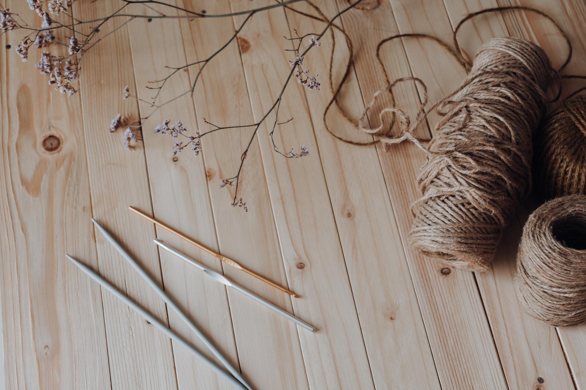 Atelier workspace with embroidery tools and linen