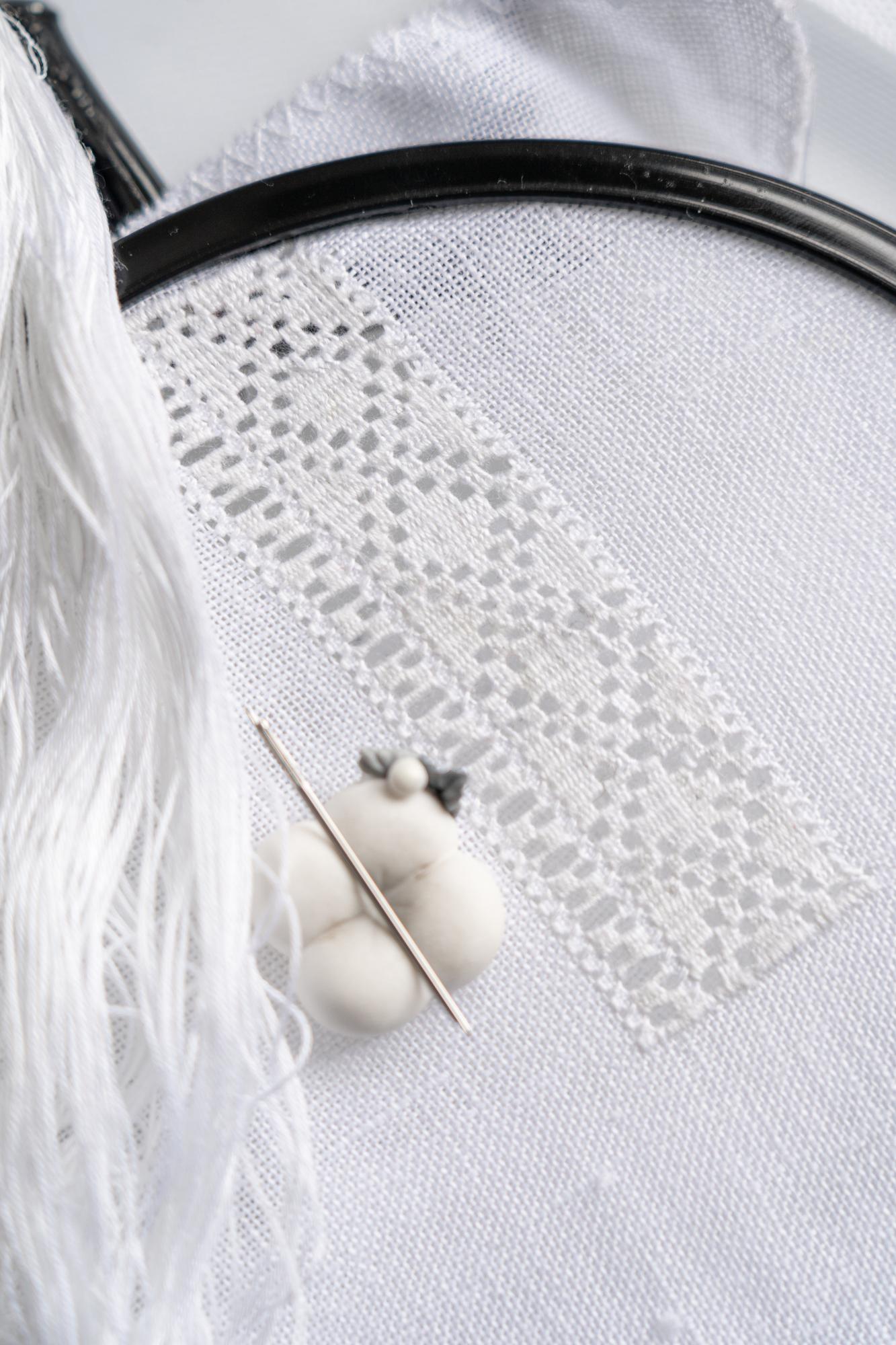 Delicate hand embroidery on linen